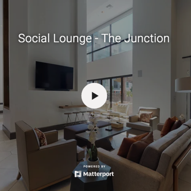 808 West - Grand social lounge with couches, chairs, television, and arcade games